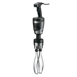 A black and silver commercial hand mixer with a thick handle, control button, and two sturdy stainless steel whisks extending downward. The industrial, robust design features a power cord from the top and stands out against a plain white background.