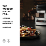 A plate of thin crepes topped with blueberries, strawberries, and mint sits in front of a commercial Crepe Maker. Text on the left reads: The WSC300 is built for Crêperies, Quick-Service Restaurants, Cafeterias. NSF and certification logos appear below.