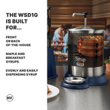 A 1 gallon stainless steel syrup dispenser with a pump sits on a counter next to a plate of waffles. Text describes it as the WSD1G—perfect for front or back-of-house, ideal for maple syrups, and for easy, even syrup dispensing.