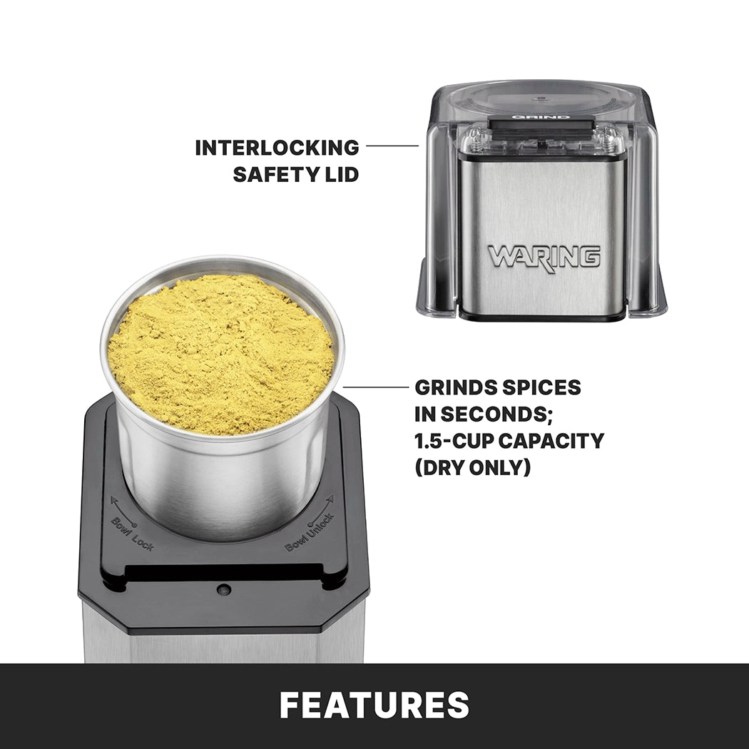 A stainless steel grinder with a clear interlocking safety lid labeled. The electric spice grinder has a removable cup filled with yellow ground spice, grinds spices in seconds, features 1.5-cup dry capacity, and highlights “Features” below.