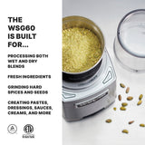 A Waring WSG60KSDI Commercial Spice Grinder, filled with greenish-yellow powder, sits next to its clear lid. Text on the left highlights: "The WSG60 is built for international use and processes wet or dry blends, spices, seeds, and more.