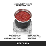 A top view of the Waring WSG60KSDI Commercial Spice Grinder with a metal bowl filled with red tomato sauce. Text highlights its 3-cup capacity for wet and dry blends, continuous hands-free operation, and pulse function for precise grinding.