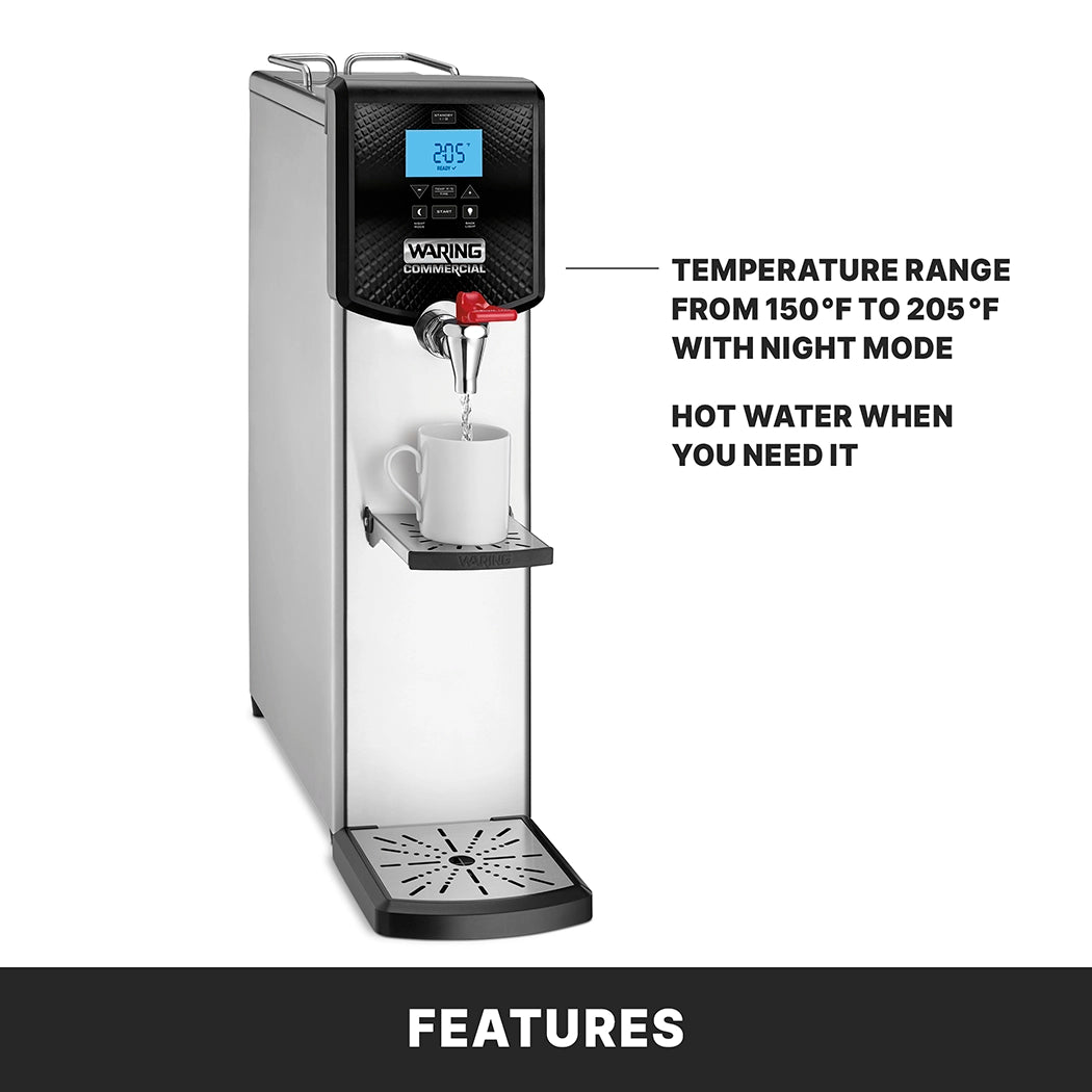 A silver Waring Hot Water Dispenser sits on the countertop, with a digital display showing 205°F. A white mug fills beneath the spout. Featuring a 5 gallon capacity, night mode, and prompt hot water access from 150°F to 205°F.