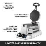 A heavy duty stainless steel waffle cone maker with a black handle and open lid, showing non-stick plates. Features include bake-time control knob, ready lights, and audio chimes. Makes up to 60 cones per hour and comes with a limited one-year warranty.