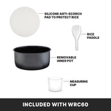 Image shows four rice cooker accessories: a white silicone anti-scorch pad, a white rice paddle, a PFAS-free non-stick pot, and a clear measuring cup. Text reads “Included with WRC60” on a black background at the bottom.