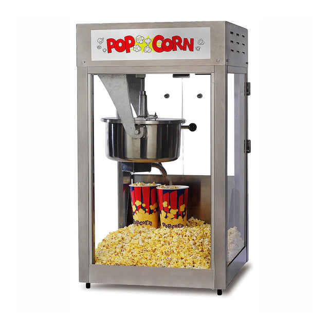 A silver Super PopMaxx popcorn machine with glass sides contains two red-and-yellow striped tubs and a pile of freshly popped popcorn. This countertop popcorn machine features an E-Z Kleen kettle and a POP CORN sign with fun popcorn illustrations on top.