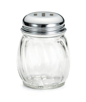 A clear, round Cheese Shaker with vertical grooves and a chrome plated slotted top featuring three rectangular holes. The shiny lid is screwed onto the swirled glass jar, which rests on a plain white background.