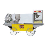 A vintage Gold Medal Products merchandising wagon with four large wheels, a yellow body labeled Caramel Corn, stainless steel popping and mixing machines using the Karmel Kool system, and a glass display case filled with popcorn labeled Pop Corn.
