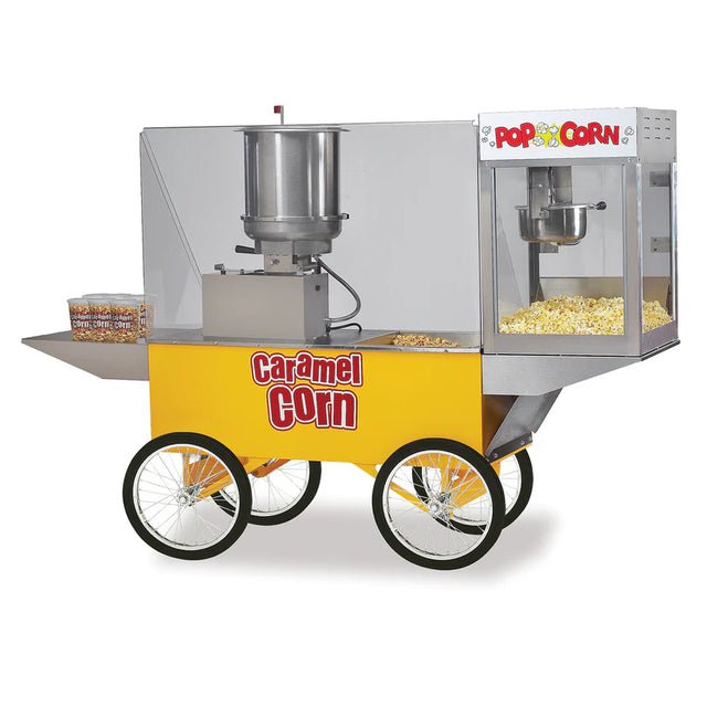 A yellow Merchandising Wagon with four large wheels features a popcorn maker and Cooker Mixer on top, a clear display case showing fresh popcorn, and three containers of Karmel Baby Caramel Corn on the side shelf. Caramel Corn is labeled in red letters.