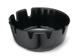 A glossy black ceramic deepwell ashtray with a round shape and four wide, evenly spaced notches cut out along the rim, giving it a distinctive, modern appearance. The surface is smooth and reflective, and the bowl sits on a flat base.