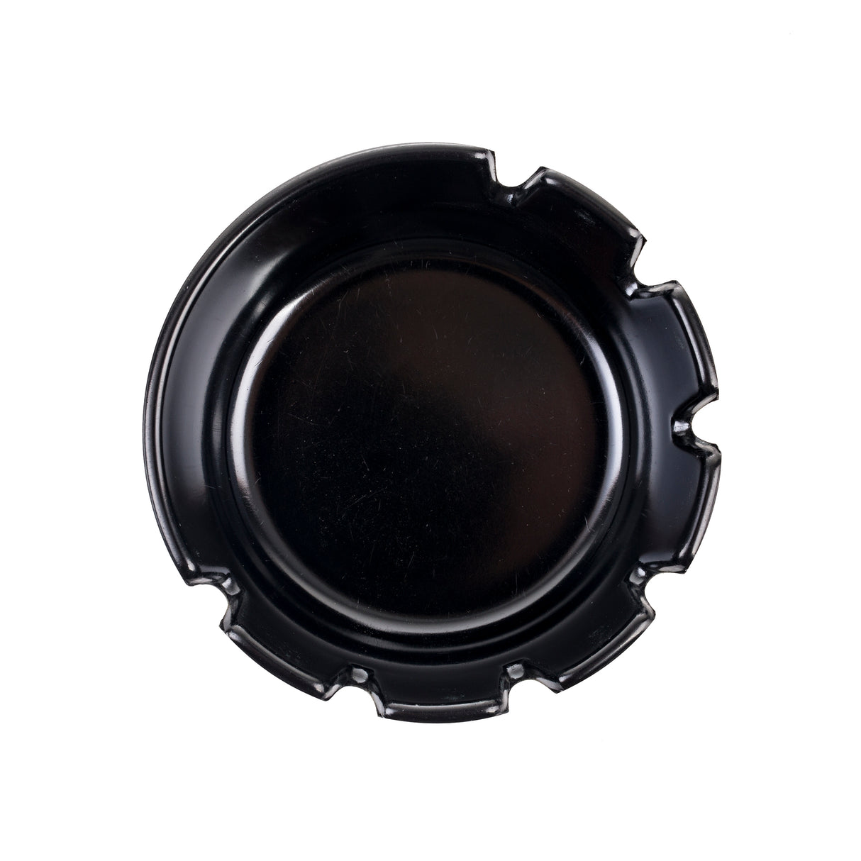 A round, shiny black phenolic ashtray with four grooves evenly spaced around the rim, designed for holding cigarettes. The deepwell ashtray is photographed from above on a plain white background.