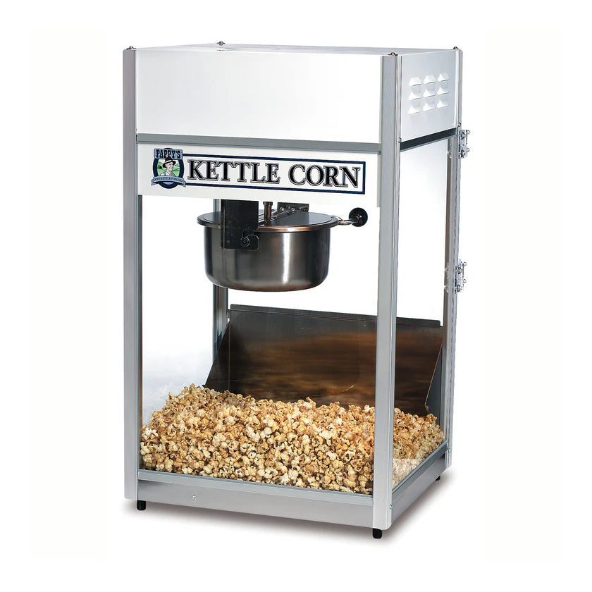 A countertop popcorn maker with transparent sides showcases a 6 oz kettle corn machine, featuring a steel popping kettle at the top and a pile of fresh kettle corn at the bottom. The front displays a “Kettle Corn” sign in bold black letters on white.