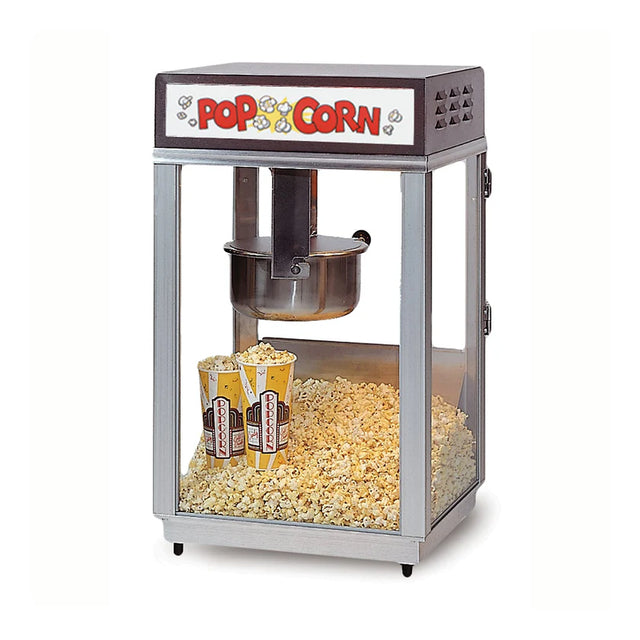 A classic Deluxe 60 Special Popcorn Popper with a glass enclosure and stainless steel kettle inside. The popcorn machine features a “Popcorn” sign at the top and two striped tubs resting among freshly popped popcorn at the bottom.