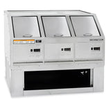 A commercial stainless steel utensil washer with three tilted, insulated compartments and digital controls. Features warning labels, an open storage shelf below for popcorn storage, and a reflective surface. The unit is branded “Gold Medal.”.