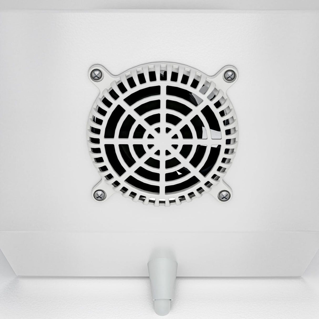 Close-up of a round, white ventilation fan with a black grille, mounted on a white ceiling near a commercial merchandiser refrigerator. Four visible screws secure the fan. A small, white, cone-shaped fixture is below it in this clean, minimalistic setting.