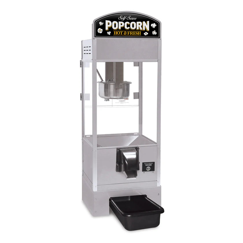 A silver countertop model popcorn popper with a clear glass front, a black and gold “Popcorn Hot & Fresh” sign on top, a self-serve dispenser lever, and a black tray at the bottom to catch popcorn; kettle and interior parts are visible.
