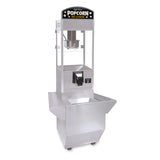 A silver popcorn popper with a glass enclosure and kettle inside. The top sign reads “Popcorn Hot & Fresh.” This countertop model features side trays on the lower base and small wheels for mobility, perfect for any snack station.