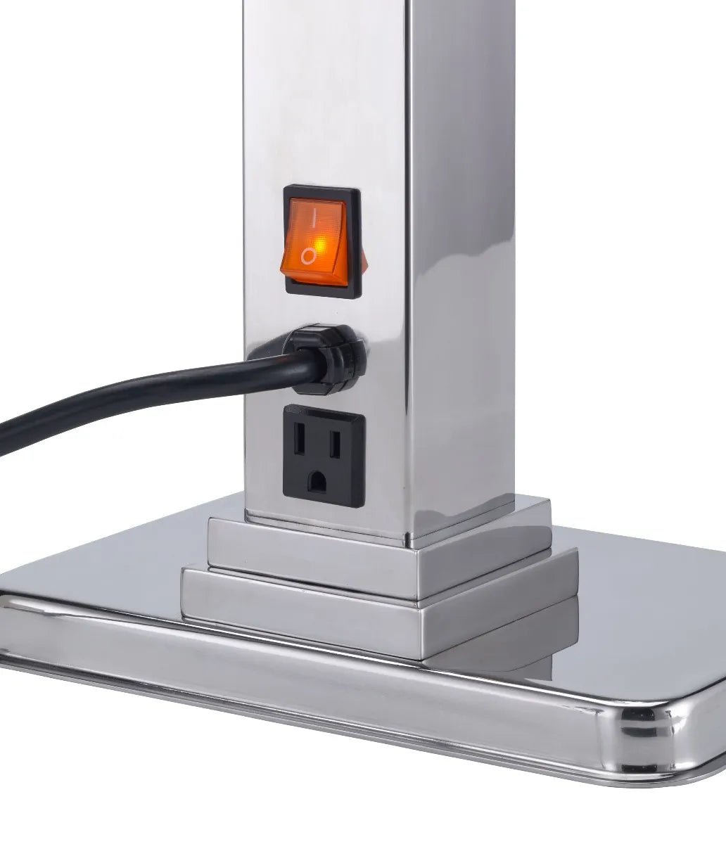 A close-up of a stainless steel base with a built-in black electrical outlet, an orange-lit power switch above it, and a black power cord plugged in. The base, part of a single heat lamp with adjustable neck, has clean, reflective surfaces and stepped edges.