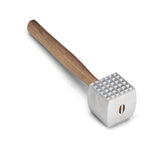 A metal meat tenderizer with a wood handle. The cast aluminum tenderizing head is rectangular, featuring a textured, pyramid-shaped grid on the striking surface for pounding and softening meat. The tool rests on a white background.