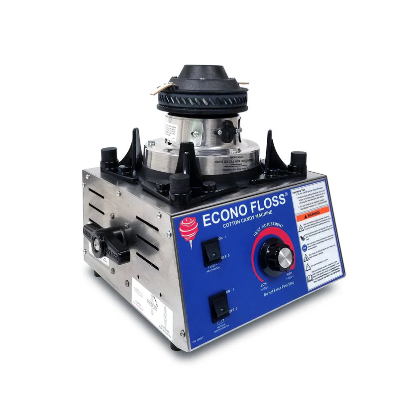 A commercial Gold Medal Products Econo Floss Cotton Candy Machine features a metal body, control panel, and spinning head. The blue, black, and white panel includes labeled buttons, caution labels, and a red indicator on a white background.