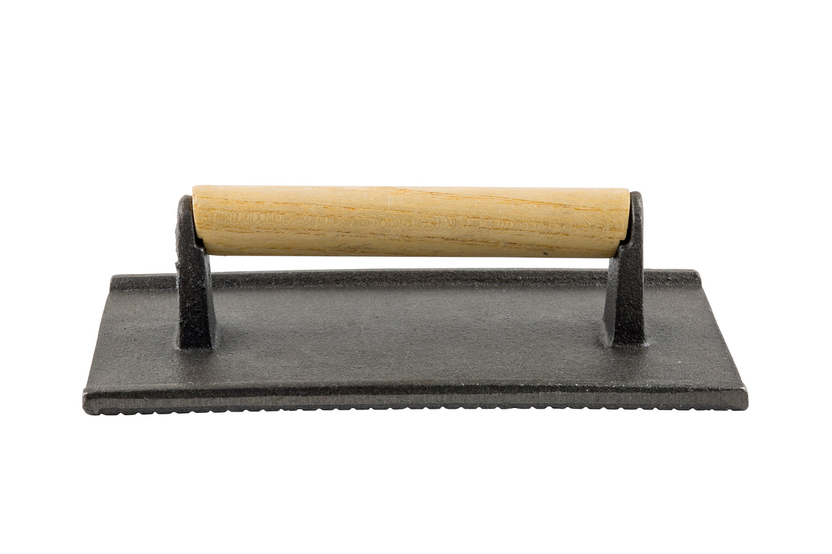 A rectangular cast iron steak weight with a flat, textured base and a horizontal wood handle attached by two metal brackets, shown against a white background.