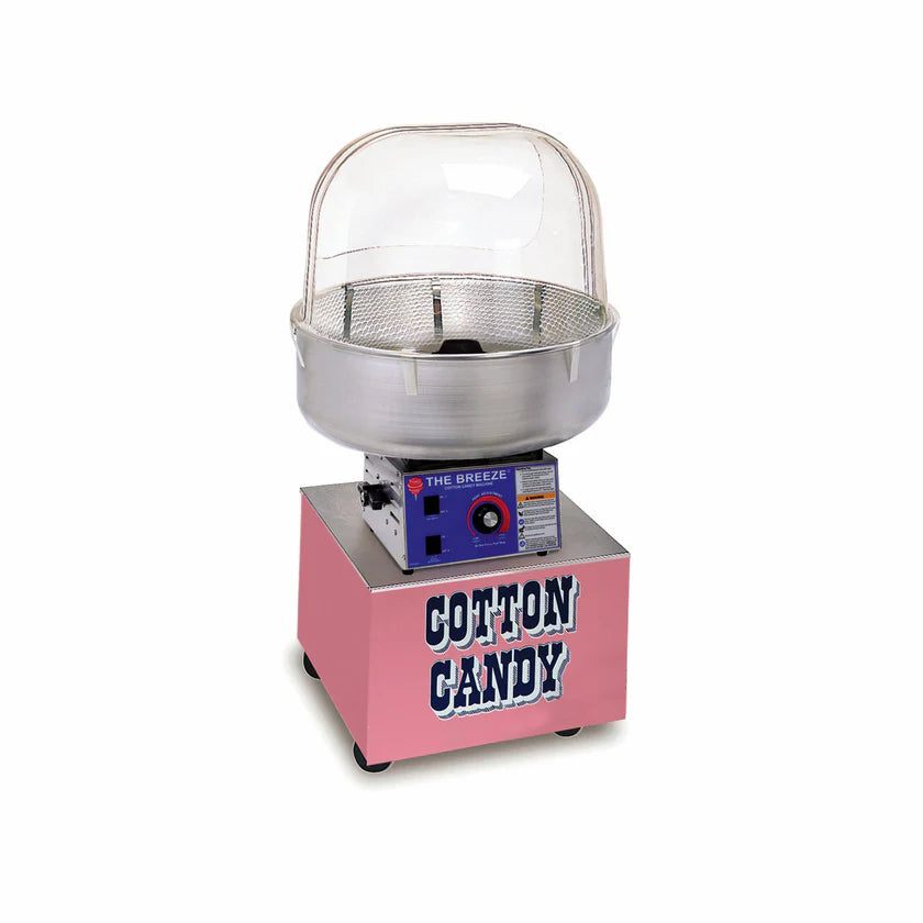 A Gold Medal Floss Machine with a pink exterior and silver accents sits on a white background. The clear dome lid tops the cotton candy cart, while the blue control panel boasts bold “Cotton Candy” lettering, knobs, and a power switch.