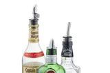 Three liquor bottles—Captain Morgan Original Spiced Rum, Gordon’s London Dry Gin, and Jack Daniel’s Tennessee Whiskey—are shown with BPA free, chrome plated jet pourers inserted into their necks against a plain white background.