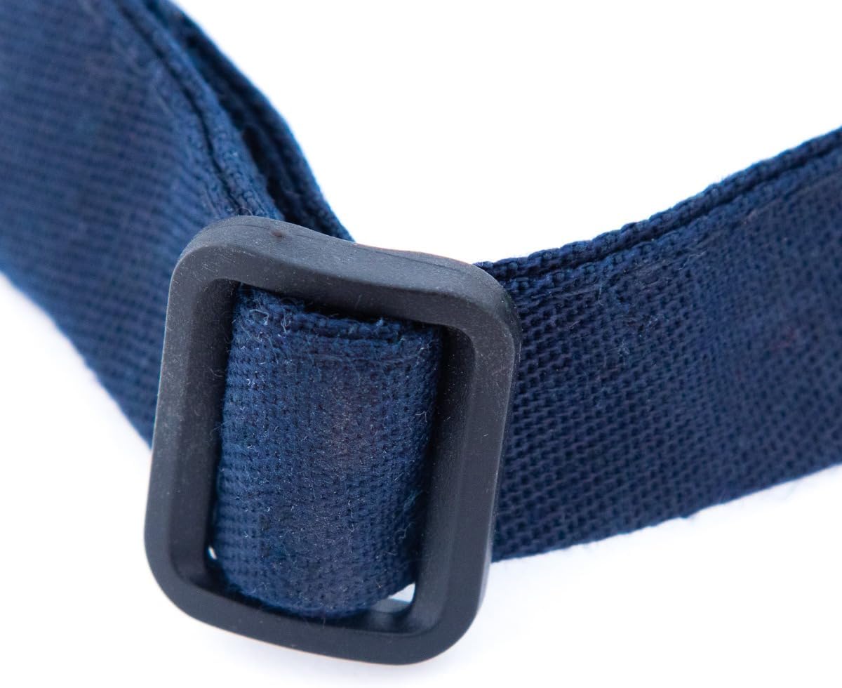 Close-up of a navy blue fabric strap threaded through a black rectangular plastic buckle, highlighting the adjustable neck feature. The woven texture stands out against the white background—perfect for a chef approved bib apron.