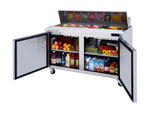 A stainless steel refrigerated prep table with two open doors. The top section displays sliced vegetables, lettuce, cheese, and deli items. The lower shelves of this Blue Air BLPT60-HC are stocked with fruits, bottled drinks, milk, and juices.