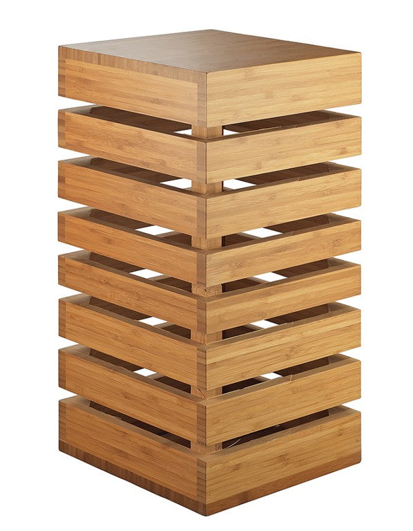 A modern, rectangular wooden Display Crate Tower made of stacked horizontal slats with open gaps between each layer. The natural wood finish gives a warm tone, and the staggered design is perfect for shelving or showcasing items.