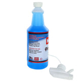 A blue bottle of Marston Chemical glass and surface cleaner with a white spray nozzle detached and lying in front. The label highlights streak-free cleaning for glass, mirrors, and stainless steel, with U.S. flag and quality guarantee icons below.