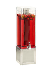 A tall, modern 3-gallon beverage dispenser features a stainless steel base and holds bright red liquid with whole strawberries floating at the top. The clear, angular design includes a front faucet for easy pouring.