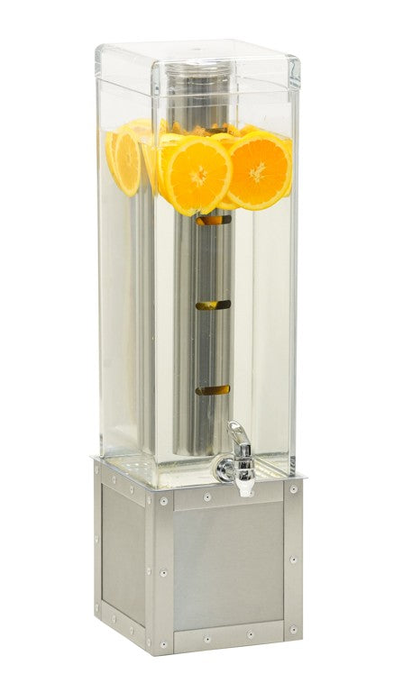 A tall, clear, 3-gallon Urban Beverage Dispenser filled with water and orange slices floating at the top. It features a metal base, a small silver spigot for pouring drinks, and an infusion chamber, all set against a plain white background.