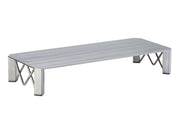 A low, rectangular metal platform with a flat surface and four angled legs. Each leg features an X-shaped support structure, giving this Industrial Riser a modern look. The metal rectangular riser has a brushed, matte finish.