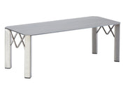 A modern metal rectangular riser with a flat silver top and four sturdy legs. The legs feature an X-shaped support, adding stability and geometric style to this minimalist industrial riser, ideal for displays like the Cal-Mil 3418-7. Plain white background.