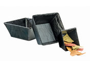 Three square, black, stone-like melamine bowls of varying sizes are arranged in a staggered, diagonal line. The smallest bowl contains assorted colored triangular chips, while the two larger bowls are empty. The bowls have a textured, handcrafted appearance.