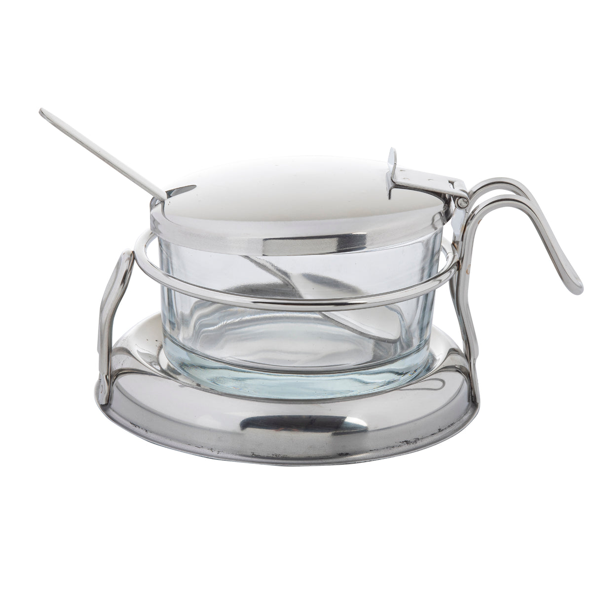A clear glass container sits in a round metal holder with a handle. A metal lid covers the bowl, featuring a notch for a metal spoon. The holder has a wide, flat base for stability and is part of a stylish condiment jar set.