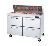 A two-section refrigerated prep table with four pull-out drawers and a chilled top displays sliced vegetables, meats, and toppings. This sandwich prep table features wheels for mobility and a digital temperature display on the front right side.
