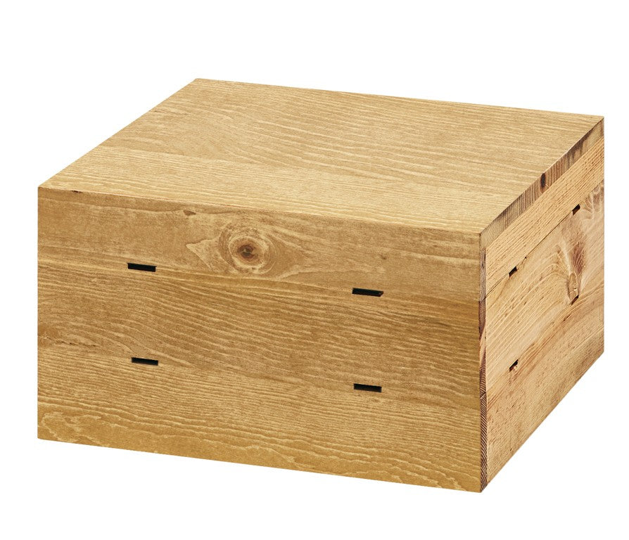 A rectangular Cal-Mil Madera Crate Riser with a rustic pine finish, featuring visible grain patterns and small rectangular ventilation slots on the front and side panels, sits on a plain white background.