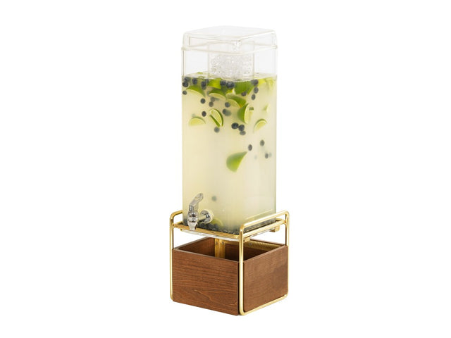 A tall, clear 3 gallon beverage dispenser filled with light yellow liquid, ice, lime slices, and blueberries stands on a gold metal frame with a wooden base and features a spigot for pouring drinks. The background is plain white.