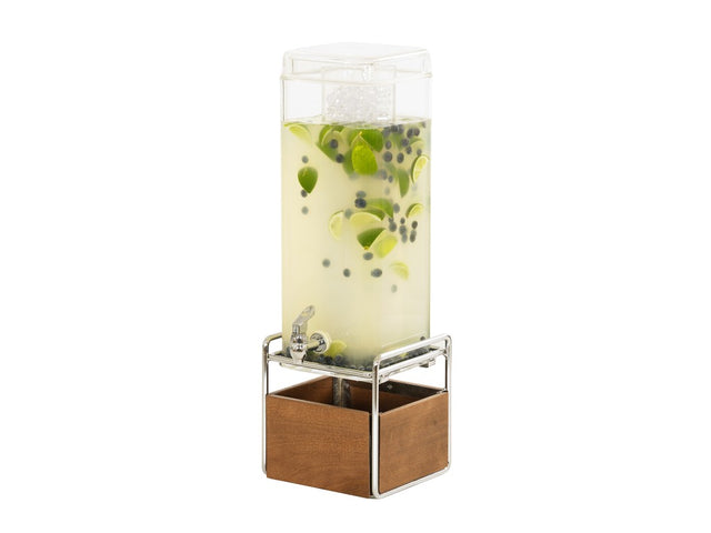 A 3 gallon beverage dispenser filled with light yellow liquid, lime slices, and blueberries sits on a metal stand with a wooden base. The dispenser has a spigot at the front and is topped with a clear plastic lid containing ice cubes.