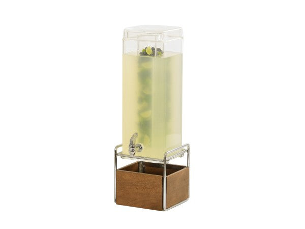 A tall, clear Mid-Century Beverage Dispenser with 3 gallon capacity, filled with light yellow liquid and floating fruit slices, sits on a metal stand with a wooden base. It features an infusion chamber, spigot, and transparent lid on top.