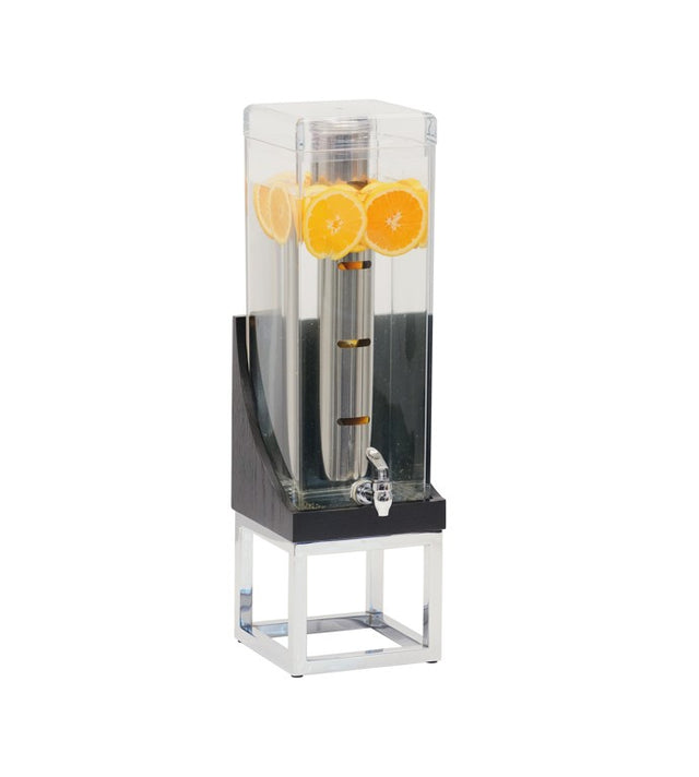 A clear, rectangular BPA Free beverage dispenser holds water with orange slices floating at the top. It stands on a silver and black metal base, featuring a spigot for drinks and a central infusion chamber likely filled with ice.