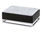 A rectangular box with a black wood base, a white marble lid featuring gray veining, and a silver metal open-frame support at the bottom. This modern design doubles as a Cinderwood Display Riser, blending natural and industrial materials seamlessly.