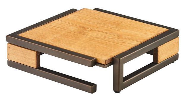 A modern, square coffee table with a light wood top and matching side panels, supported by a dark metal frame in a bronze finish. Open sides and mixed materials give it a minimalist, contemporary look. The table sits low to the ground.