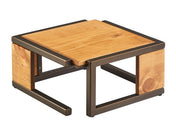A modern square coffee table with a rustic pine top and matching wooden side panels, framed by a dark metal structure. The minimalist, geometric design features clean lines and visible wood grain for a contemporary look.