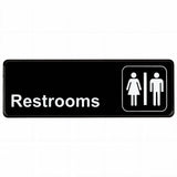 A black rectangular Restrooms sign with white text and gender icons, featuring a pressure sensitive adhesive for easy application, clearly indicates public restroom facilities for all genders.