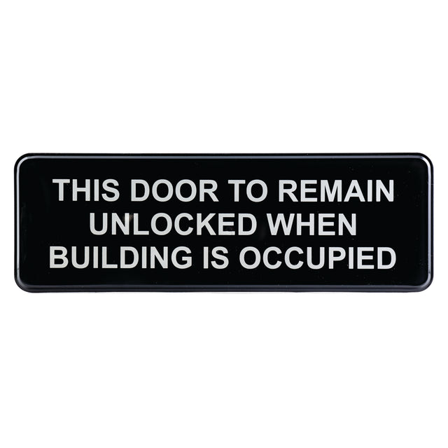 A black rectangular Door Unlocked Sign with white, bold, capital letters reads: “THIS DOOR TO REMAIN UNLOCKED WHEN BUILDING IS OCCUPIED.” Features adhesive backing for easy installation.