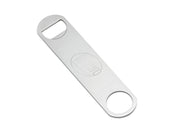 A stainless steel pocket bottle opener with a brushed finish, featuring a rectangular body and rounded ends. One end has a standard bottle-opening notch, the other a large hole. TEAM CRAFT is engraved in the center and it’s dishwasher safe.