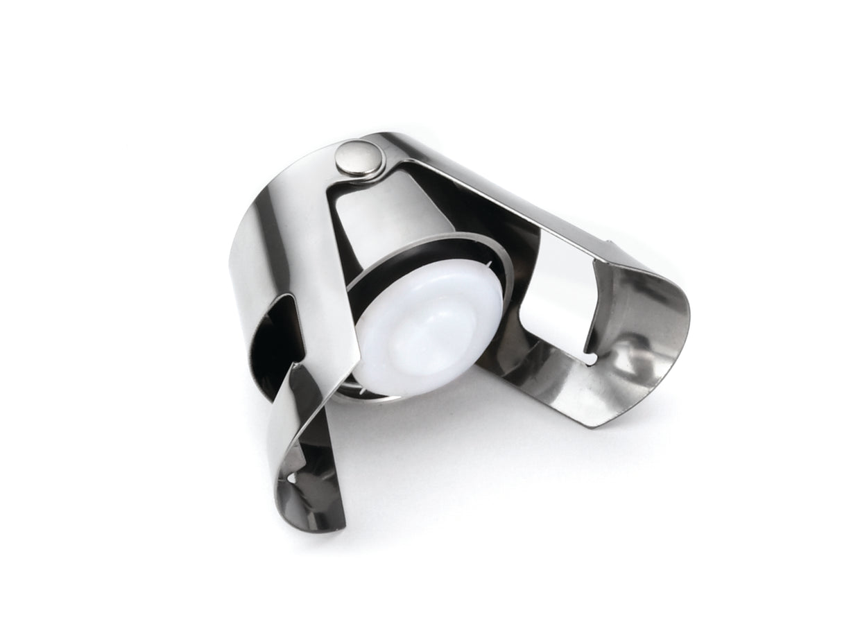 A sleek, durable Champagne Bottle Sealer made of stainless steel with a white plastic seal is shown against a white background. Its hinged arms grip the bottle neck securely and the stopper is dishwasher safe for easy cleaning.